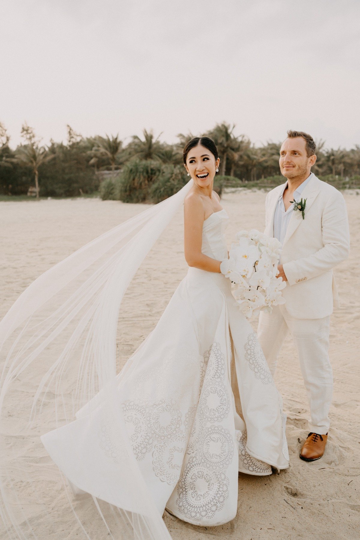 bride and groom at beach wedding in vietnam