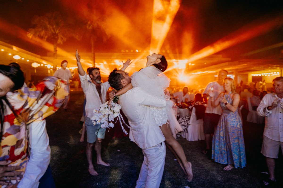 bride and groom dancing at concert reception