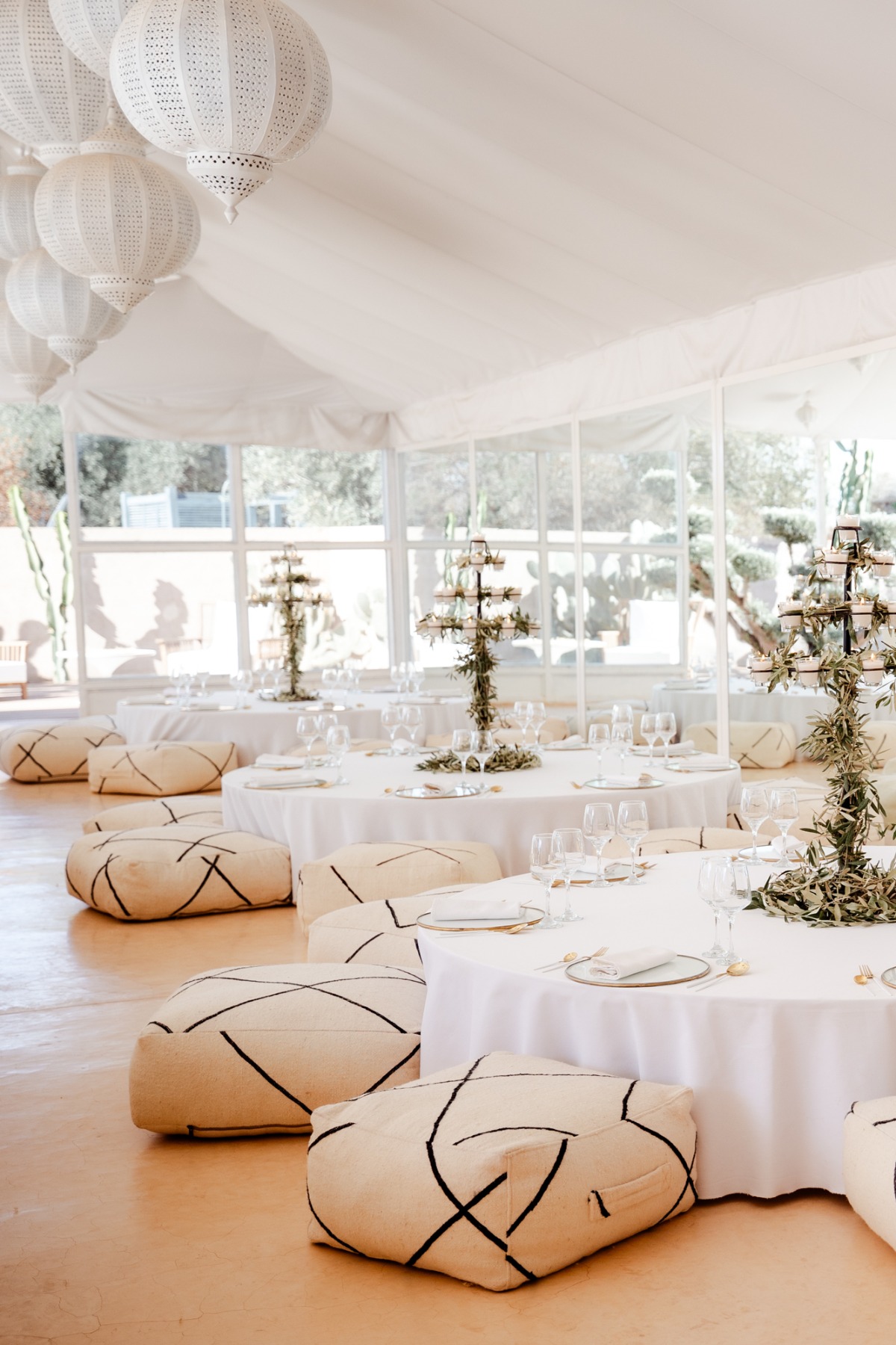 white metal lanterns and pouf seating for moroccan reception