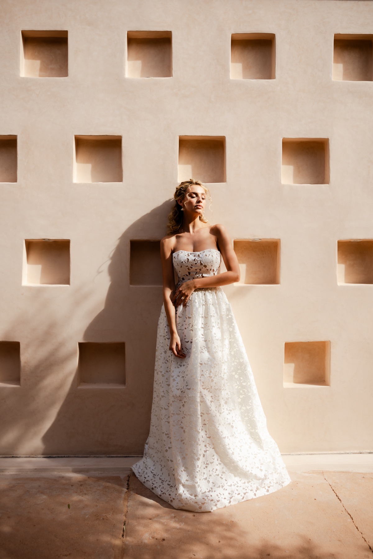 bride in strapless lace wedding dress for modern desert wedding