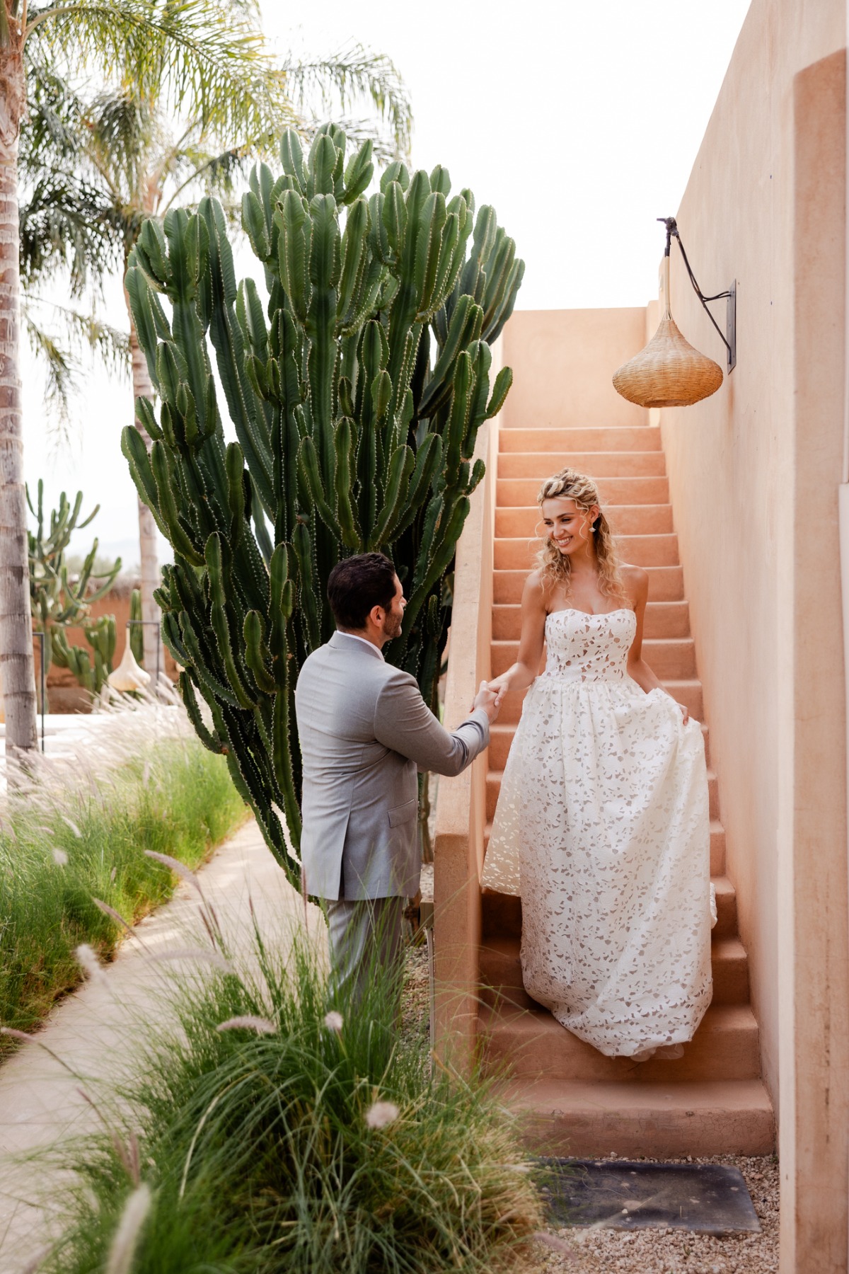 bride in lace wedding dress at rooftop Moroccan wedding