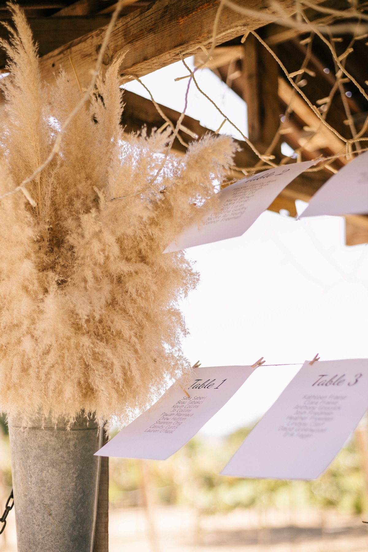 Chic and minimalist table numbers hanging on clothesline