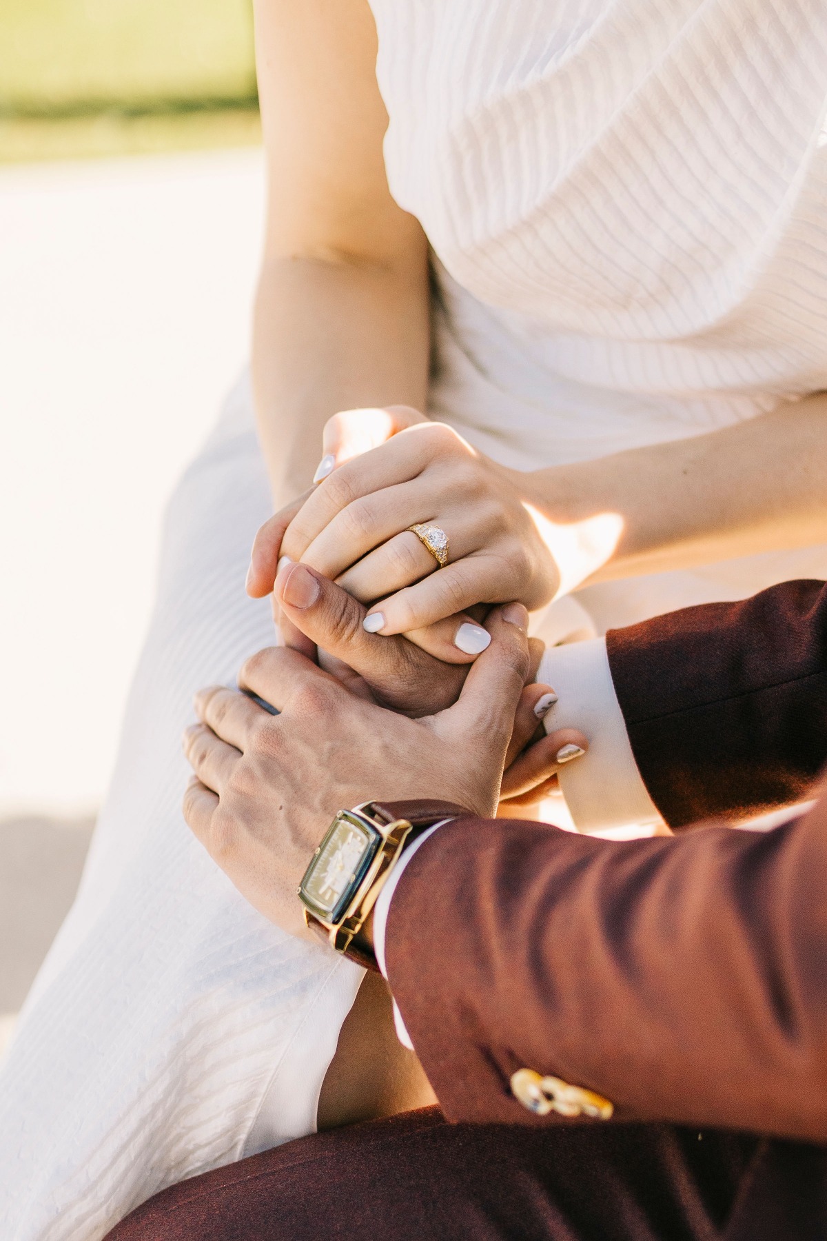 Bride and groom holding hands at romantic wedding ceremony