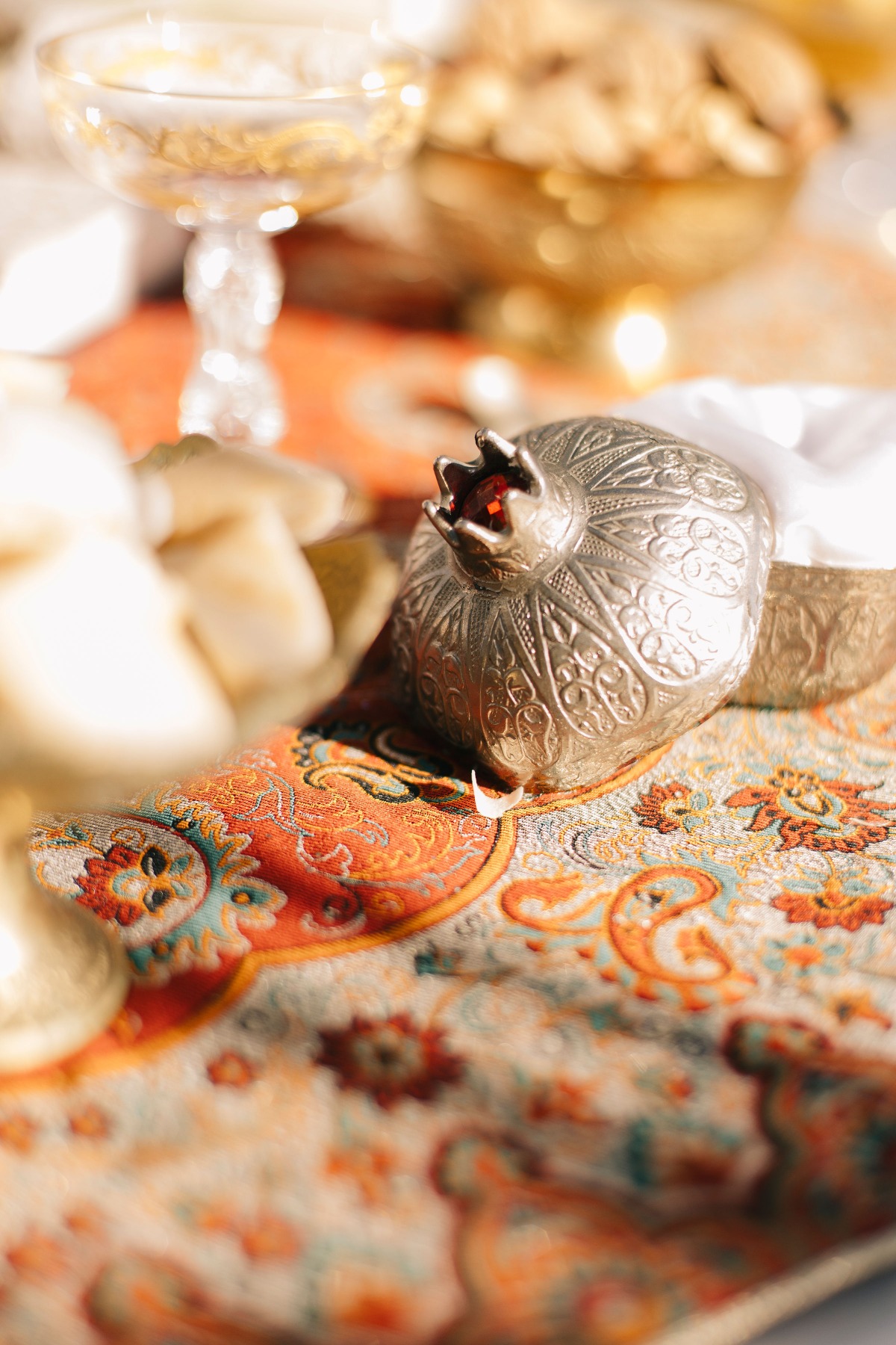 Unique silver and ruby pomegranate for cultural wedding ceremony