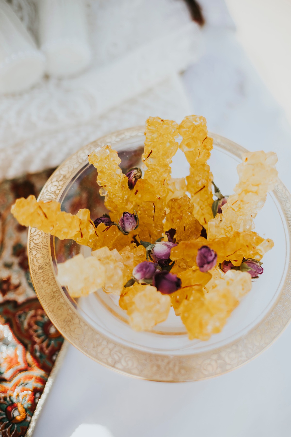 Vibrant rock candy and flowers for cultural wedding ceremony