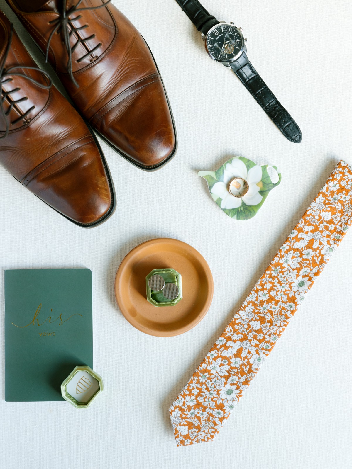 Bold and colorful orange floral details from modern groom 