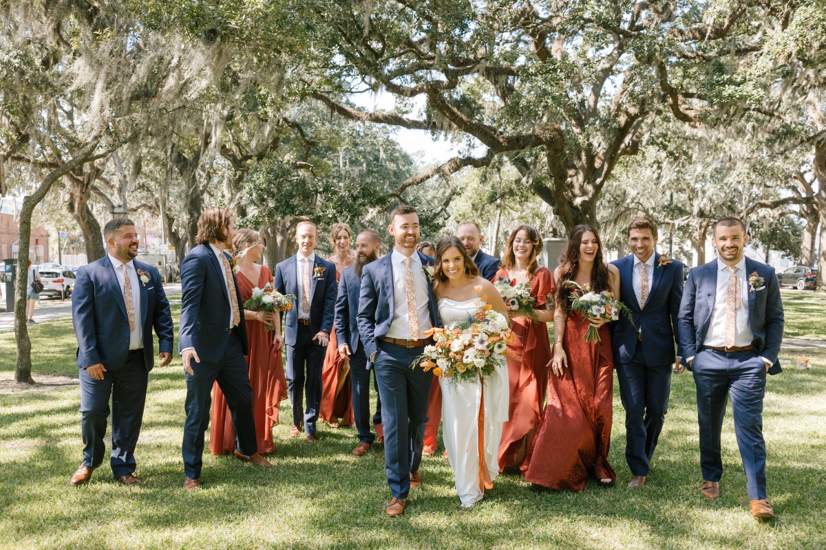 Dark blue and terracotta orange bridal party attire 