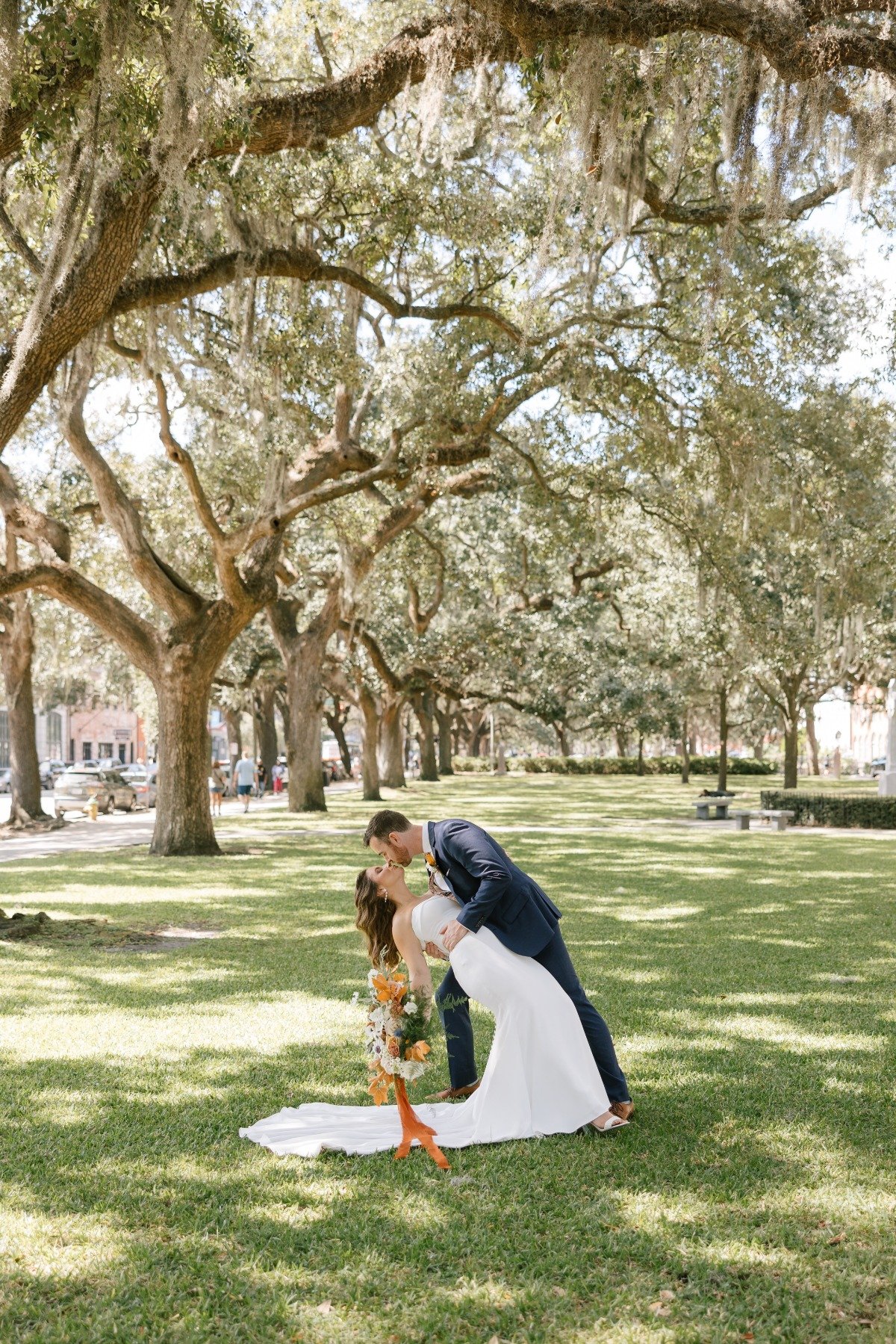 Savannah Georgia bride and groom kiss at local park 