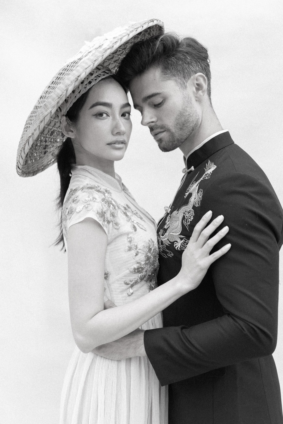 Eastern bride and Western groom in traditional Chinese attire