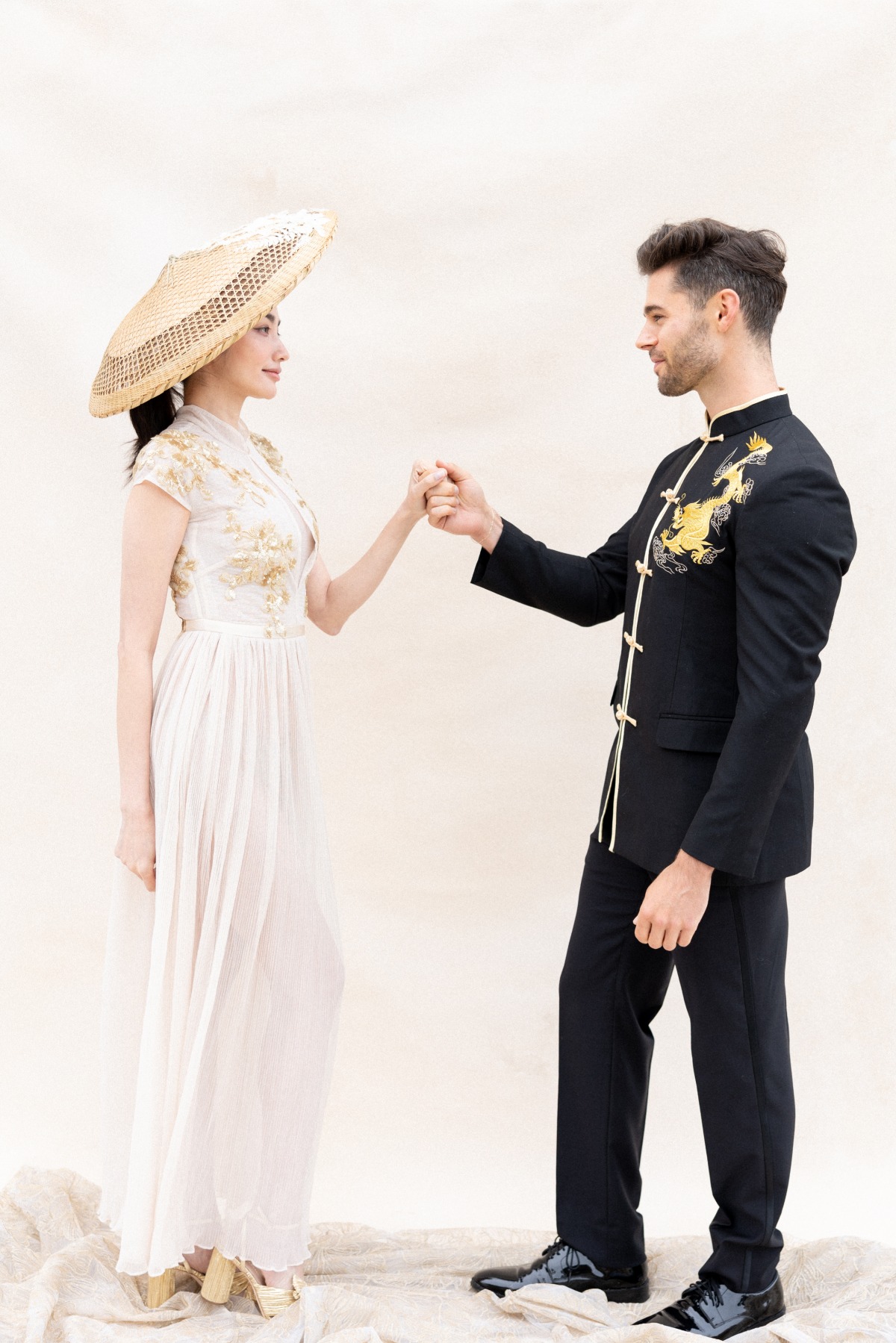 Traditional bride in gold and white cheongsam wedding dress