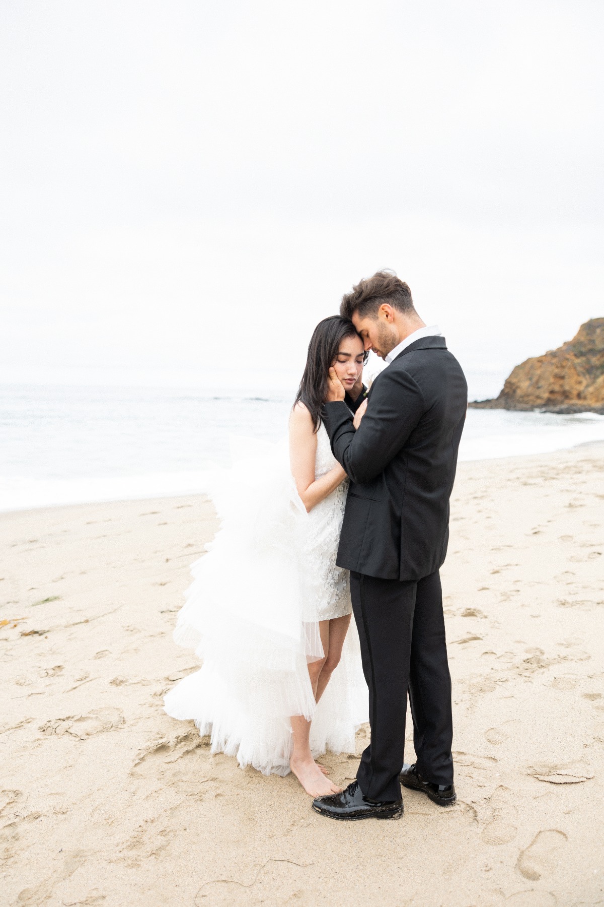 Romantic bride and groom wedding portraits on the beach