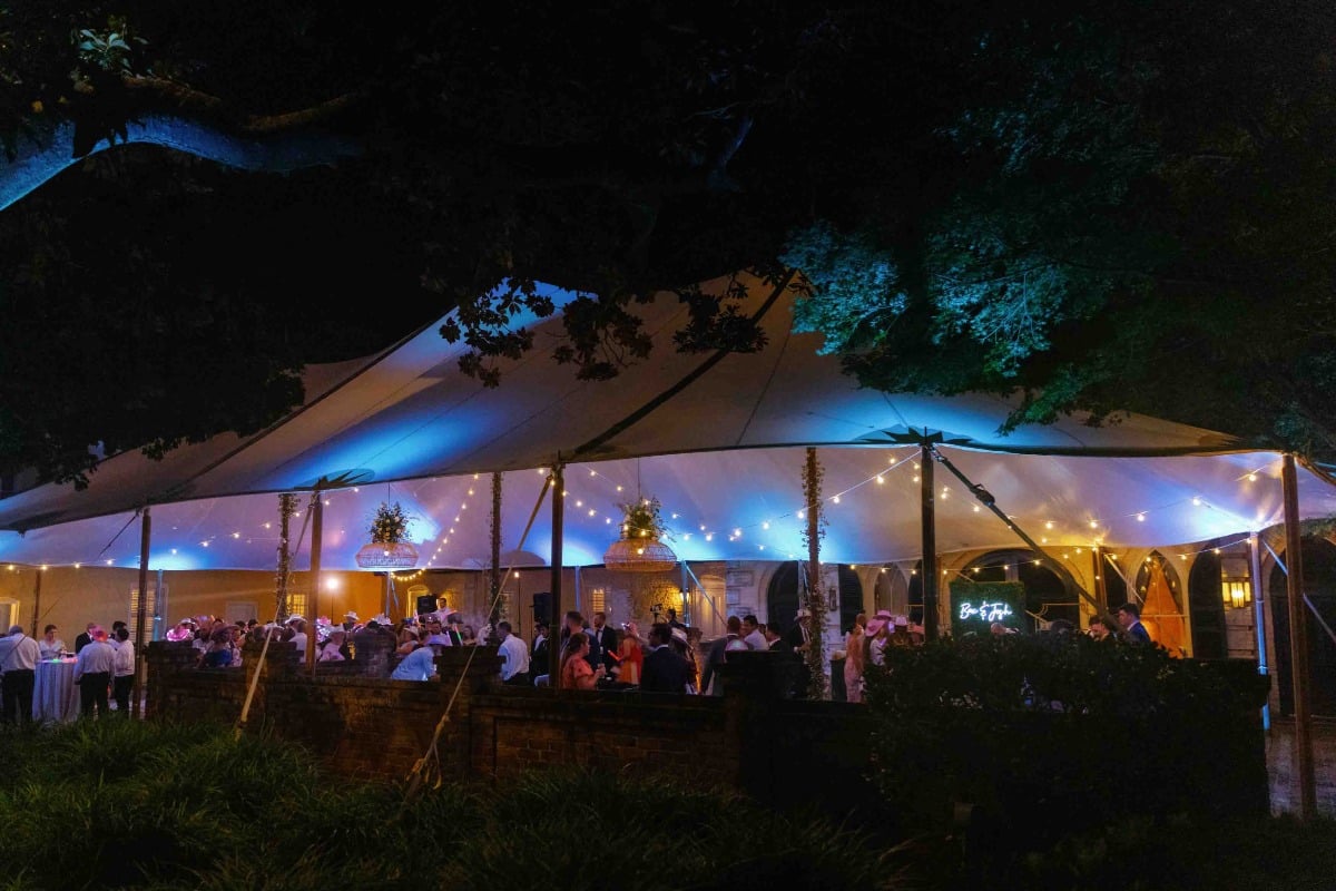 Sailcloth tented reception with string lights in Charleston