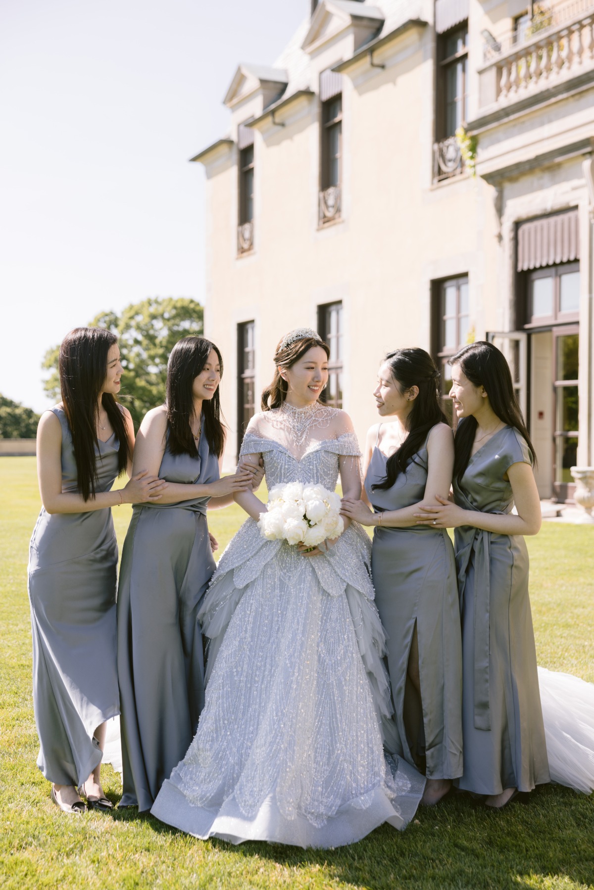 bride with mix and match bridesmaids in gray dresses