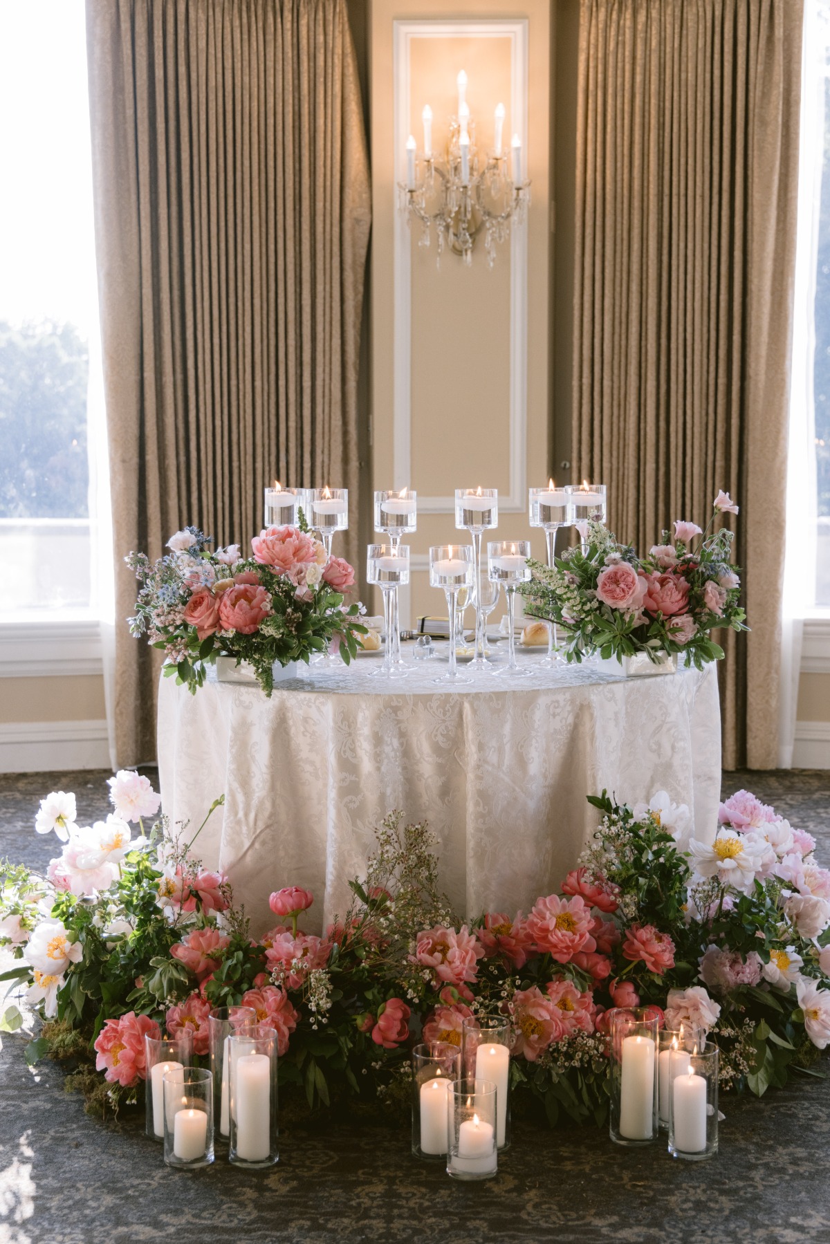 coral and pink flower arrangements at sweetheart table