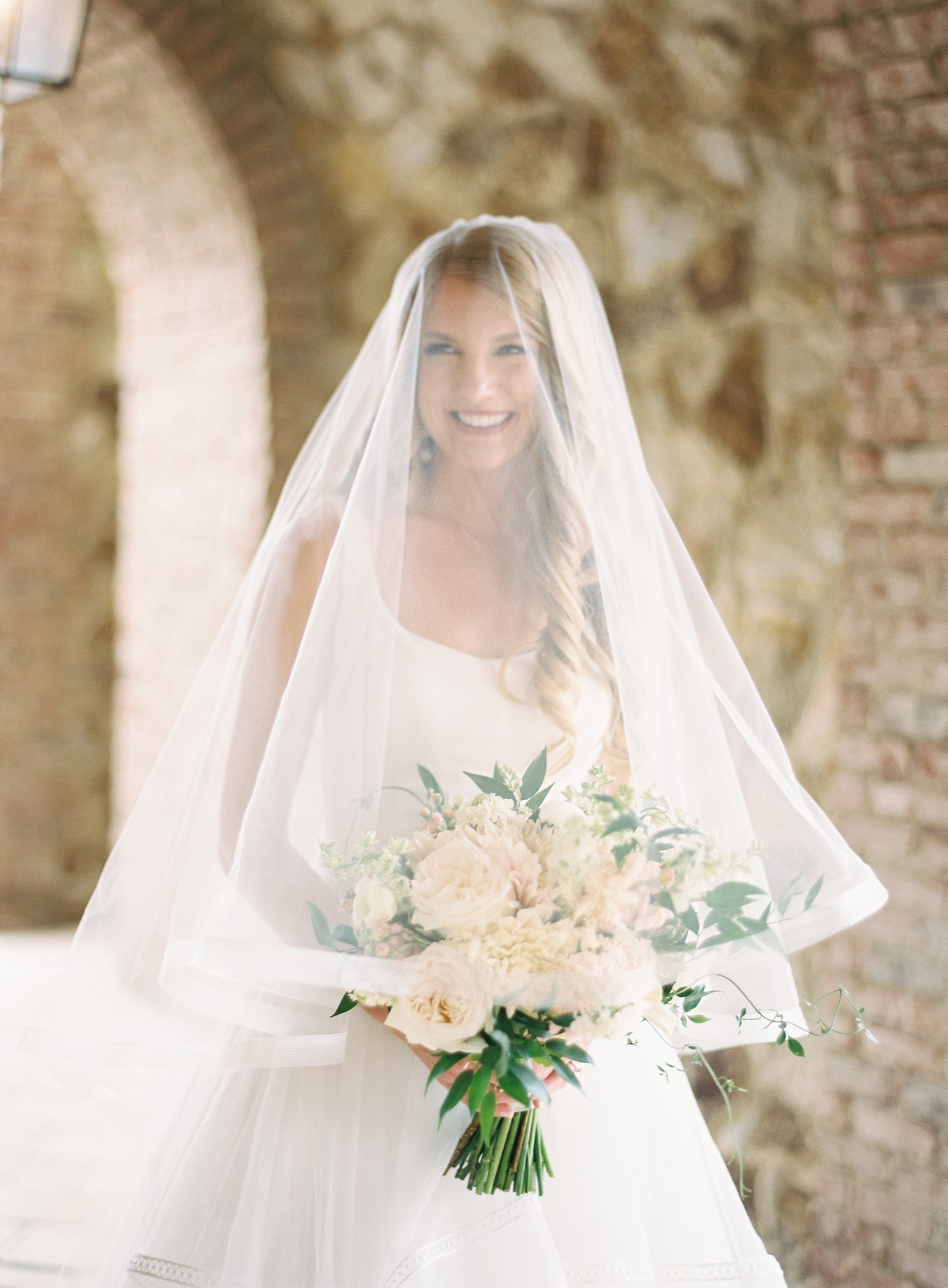 Magnolia Laine wedding gown with matching trimmed veil 