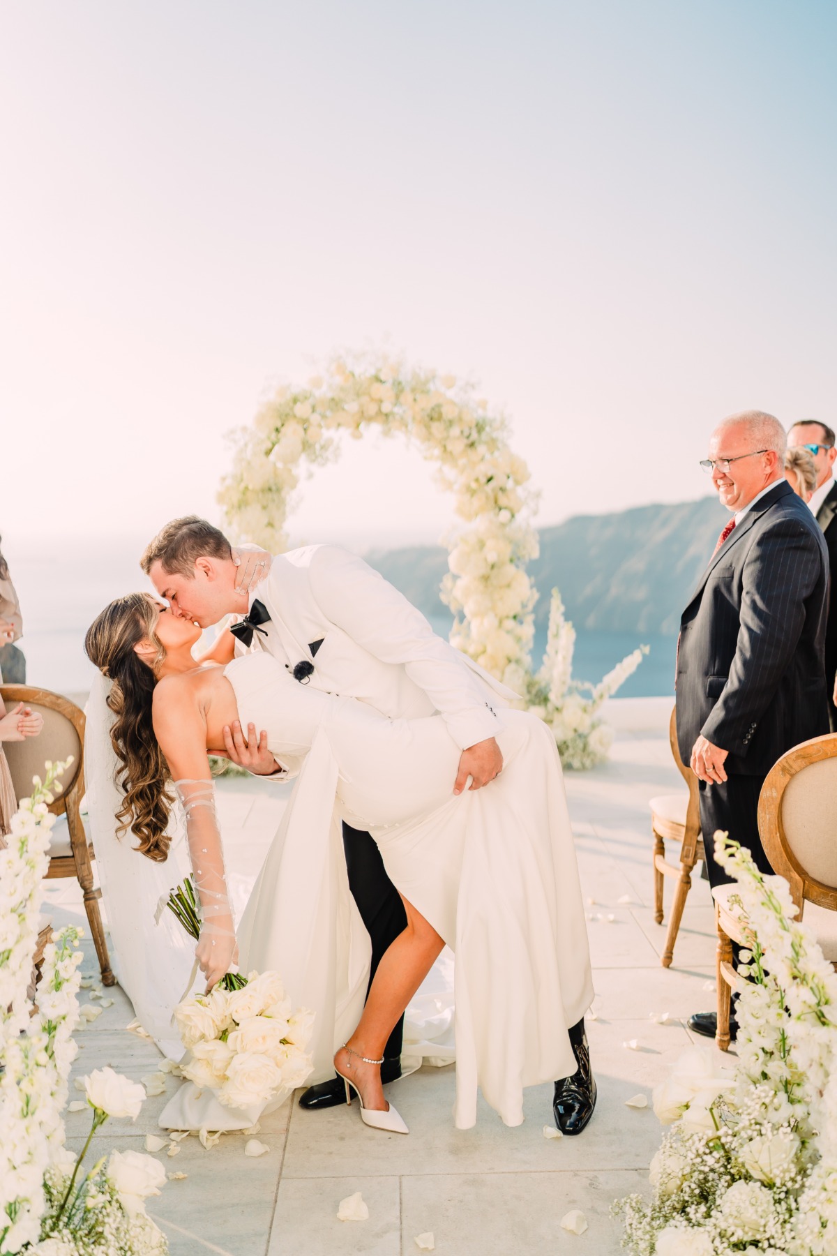 aisle lined with white roses and baby's breath