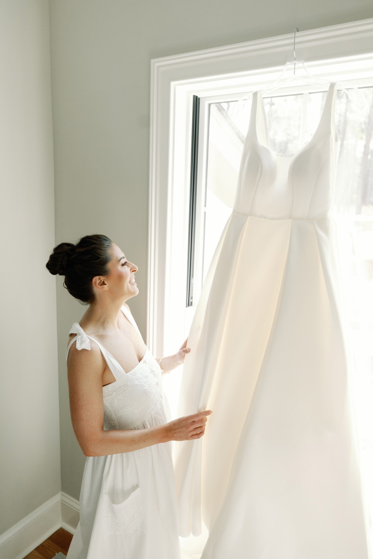 bride getting ready with her a line gown