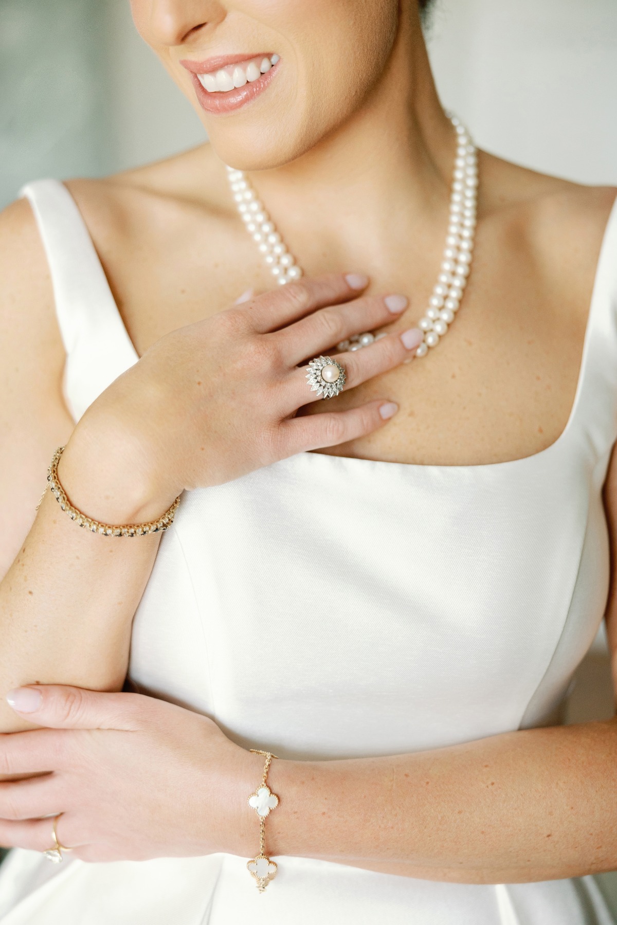 bride wearing heirloom pearl ring and necklace