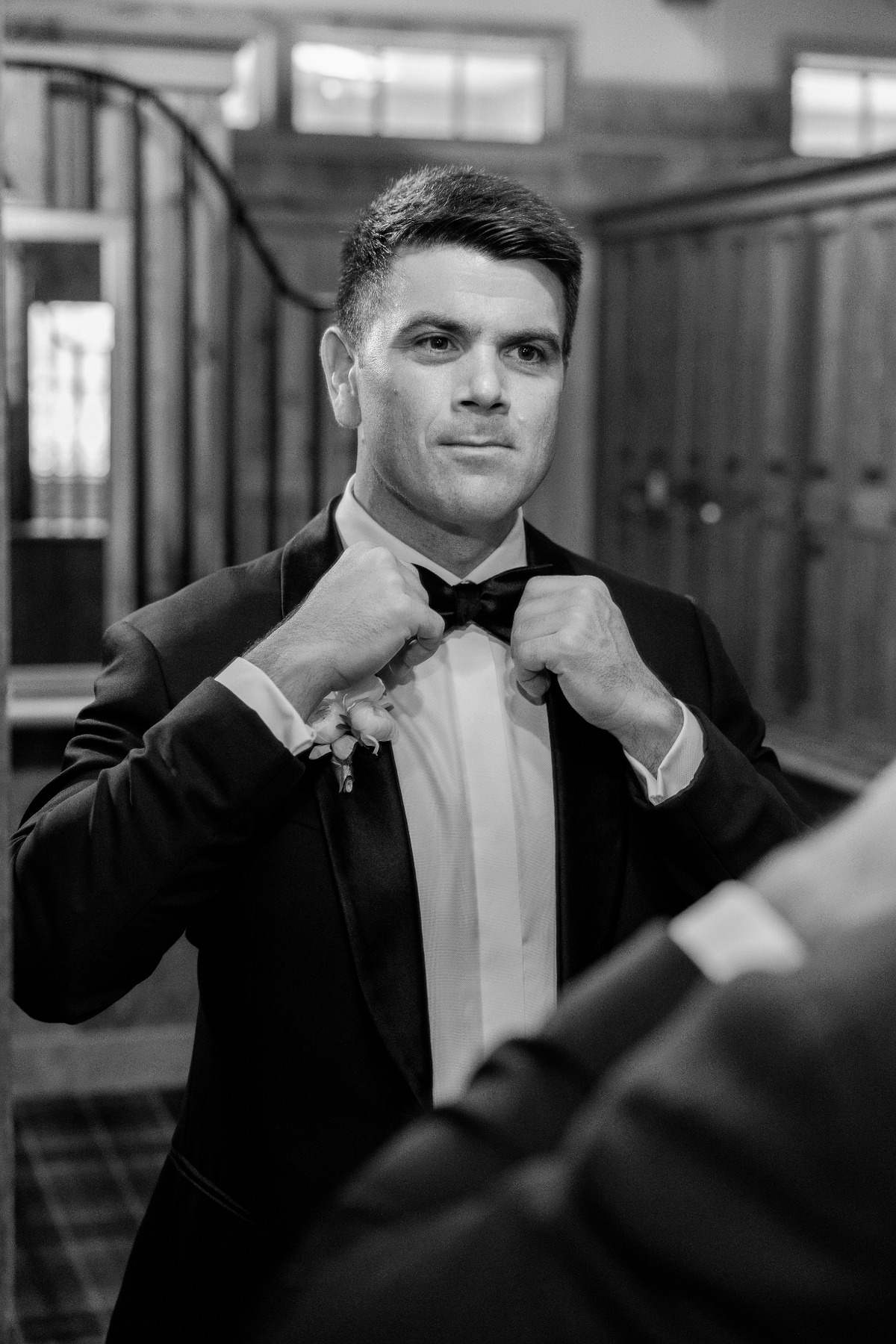 groom getting ready black and white photography