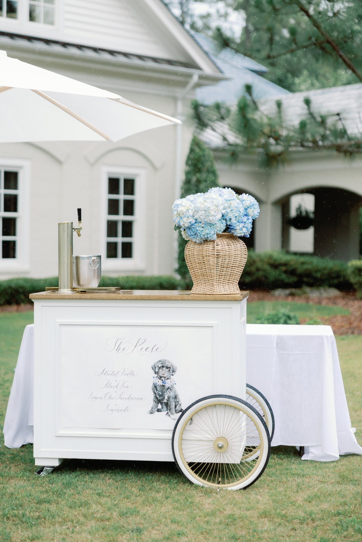 blue and white hydrangea wedding flowers on bar cart