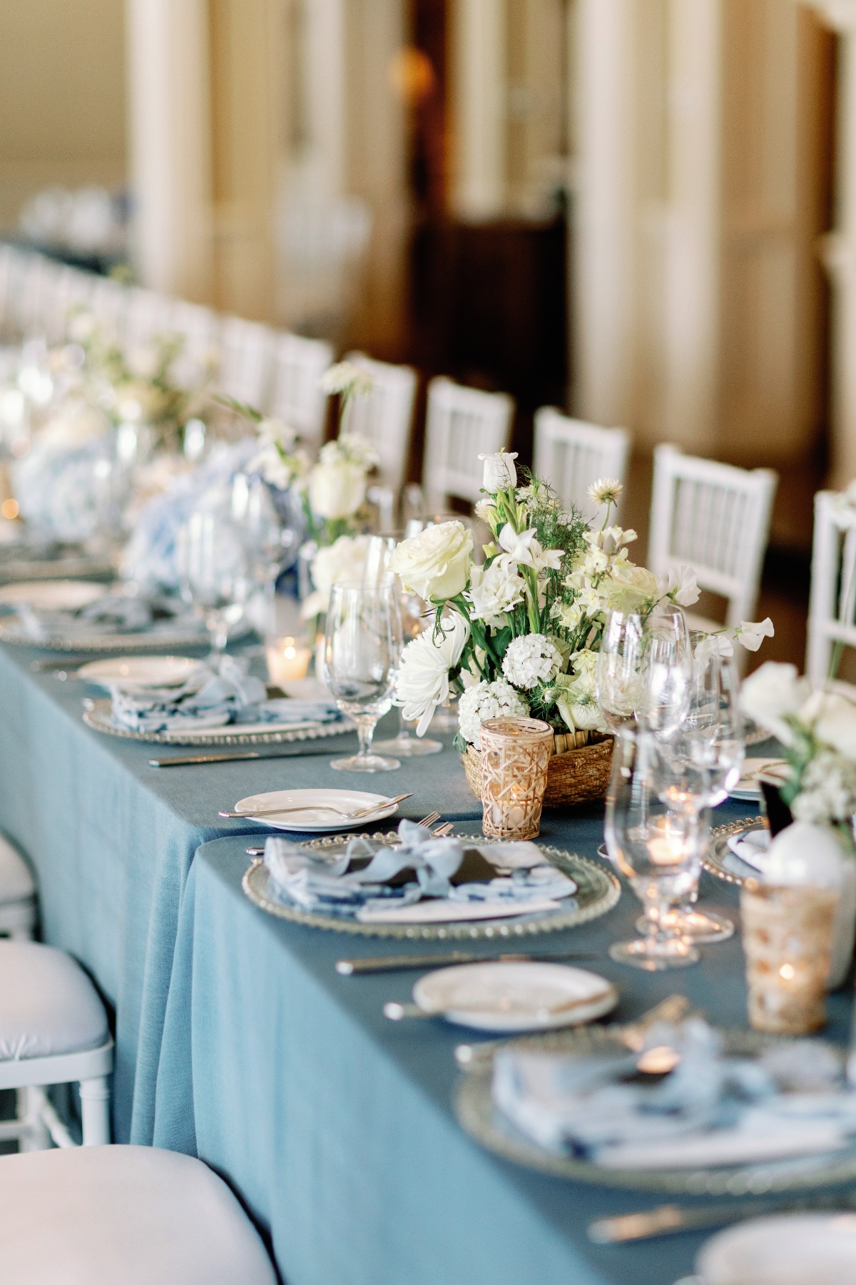 blue and white wedding reception with raffia arrangements