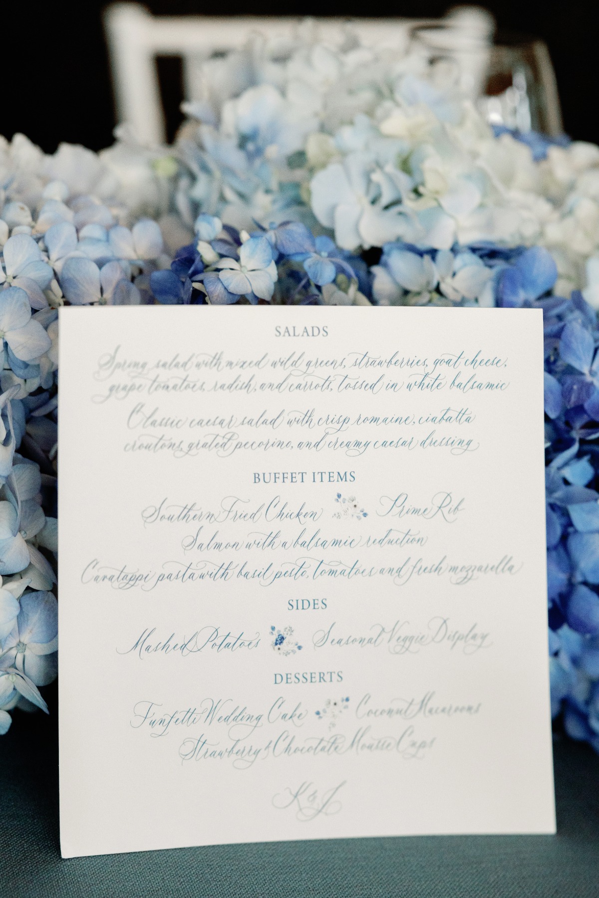 blue and white handwritten menu for wedding reception