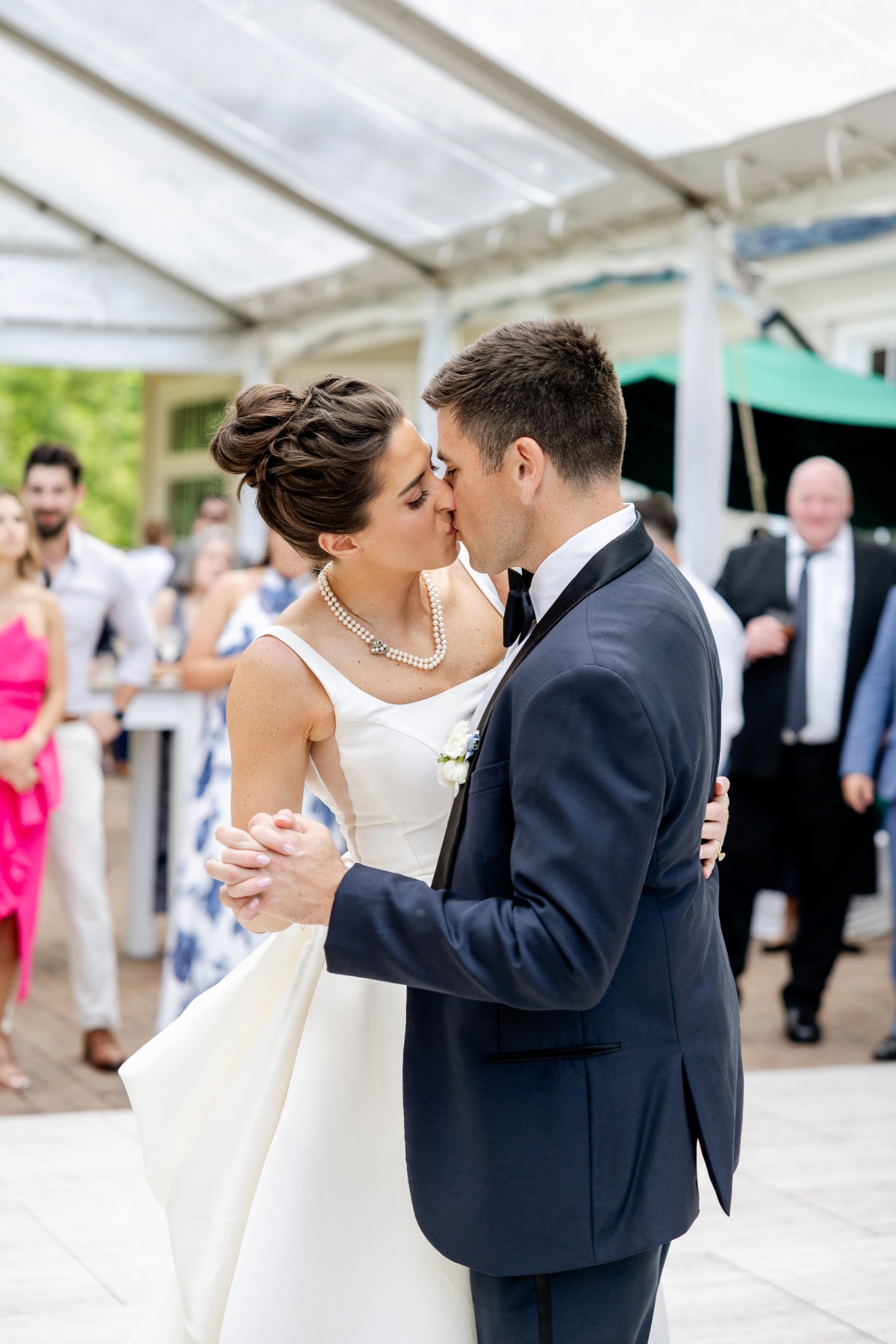 bride and groom first dance at tented reception