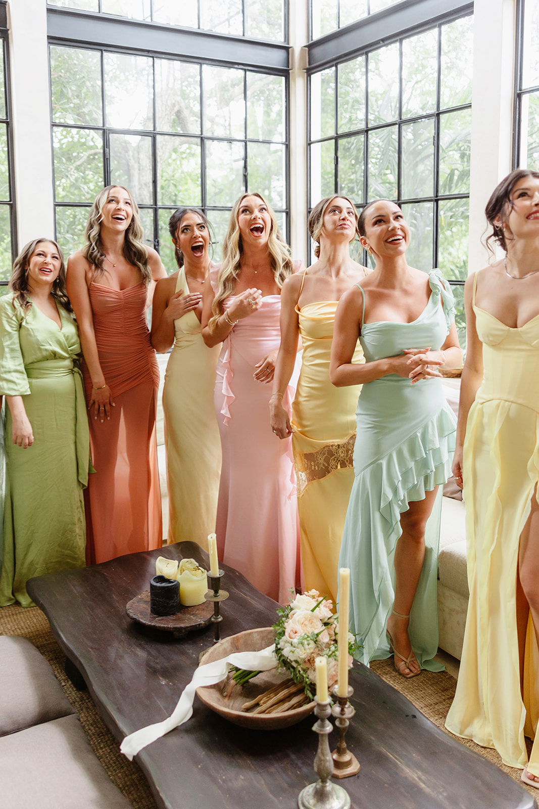 Chic pastel rainbow bridesmaid dresses in varying styles