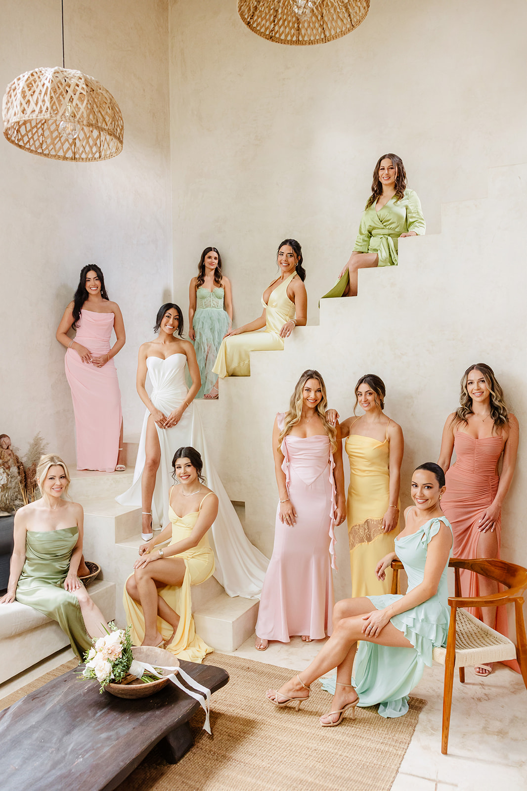 Chic and stylish pastel rainbow bridesmaids on modern stairs