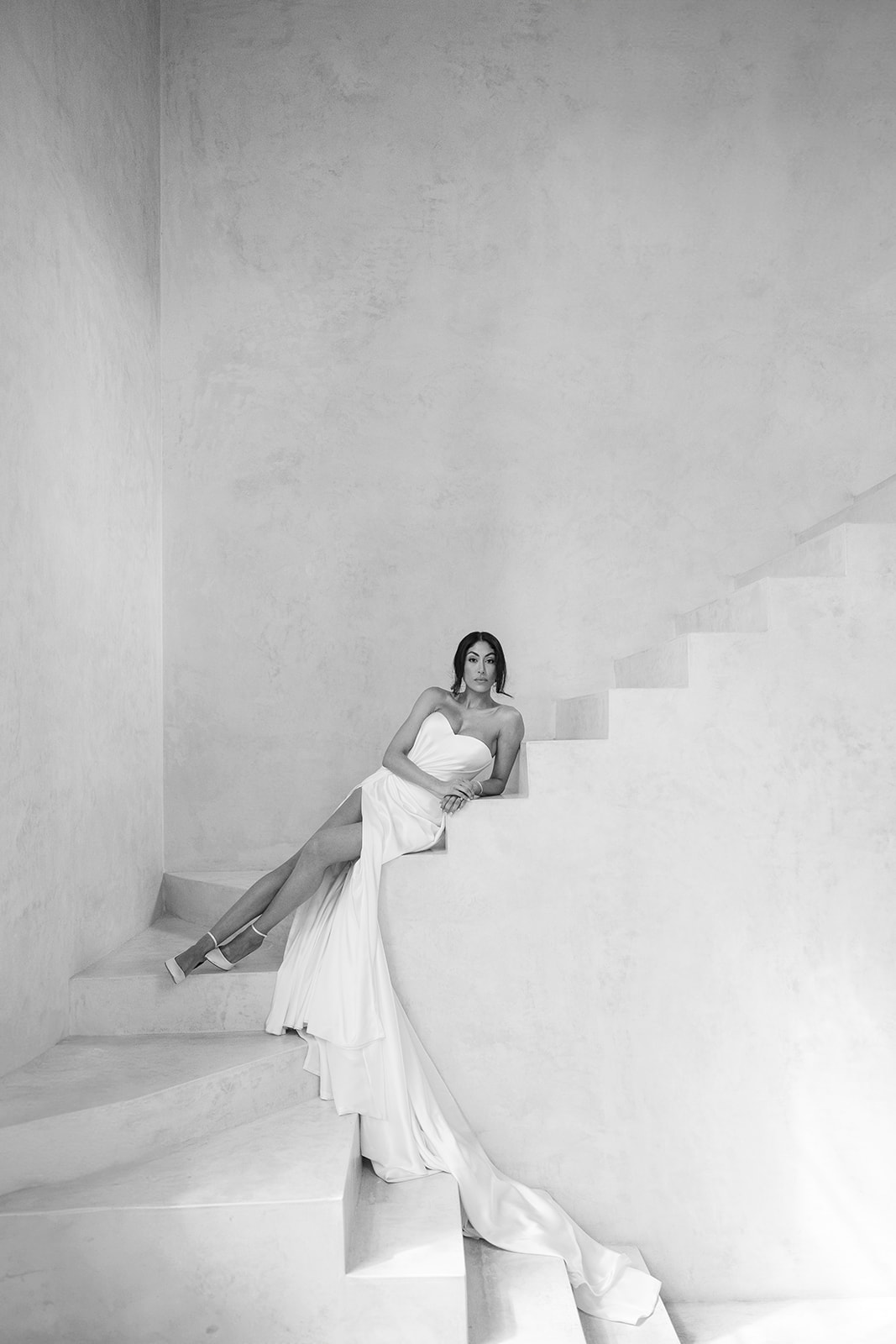 Modern Tulum bride lounging on stairs in custom Galia Lahav