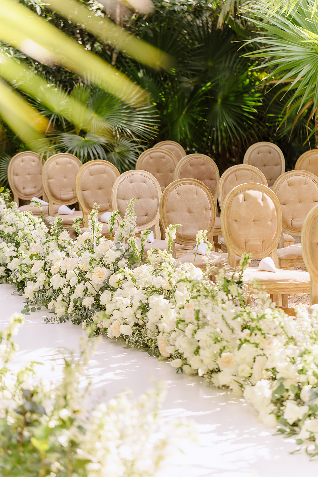 Lush white and green aisle flowers at Tulum jungle wedding