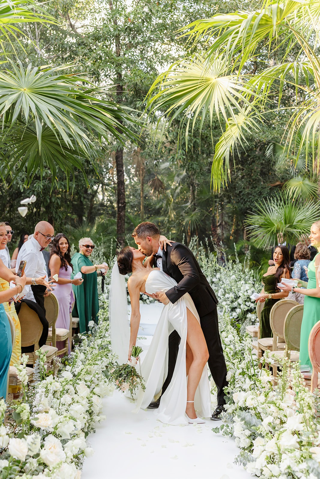 Tulum bride and groom first kiss dip after jungle ceremony