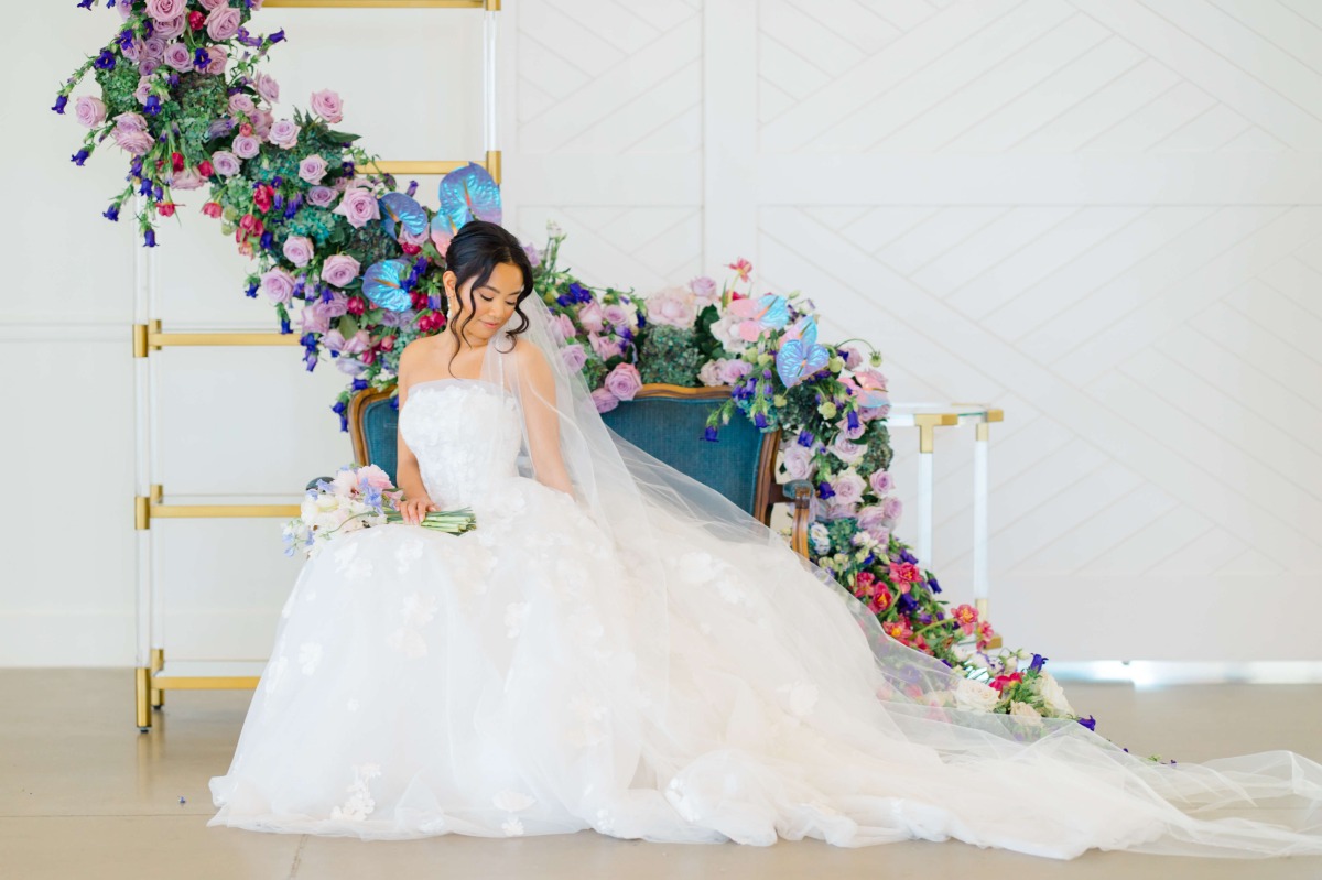 cascading floral installation on vintage couch