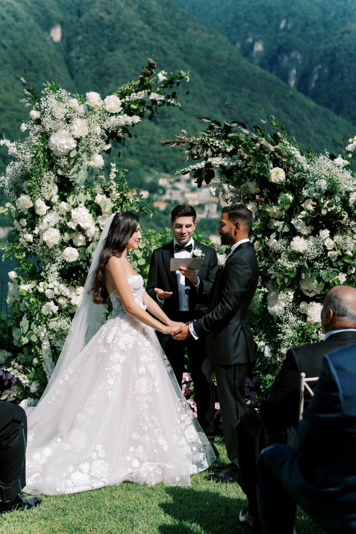 white floral arch wedding ceremony on lake como