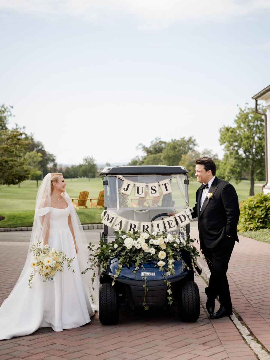 The couple drove off in a golf cart at their NJ country club wedding