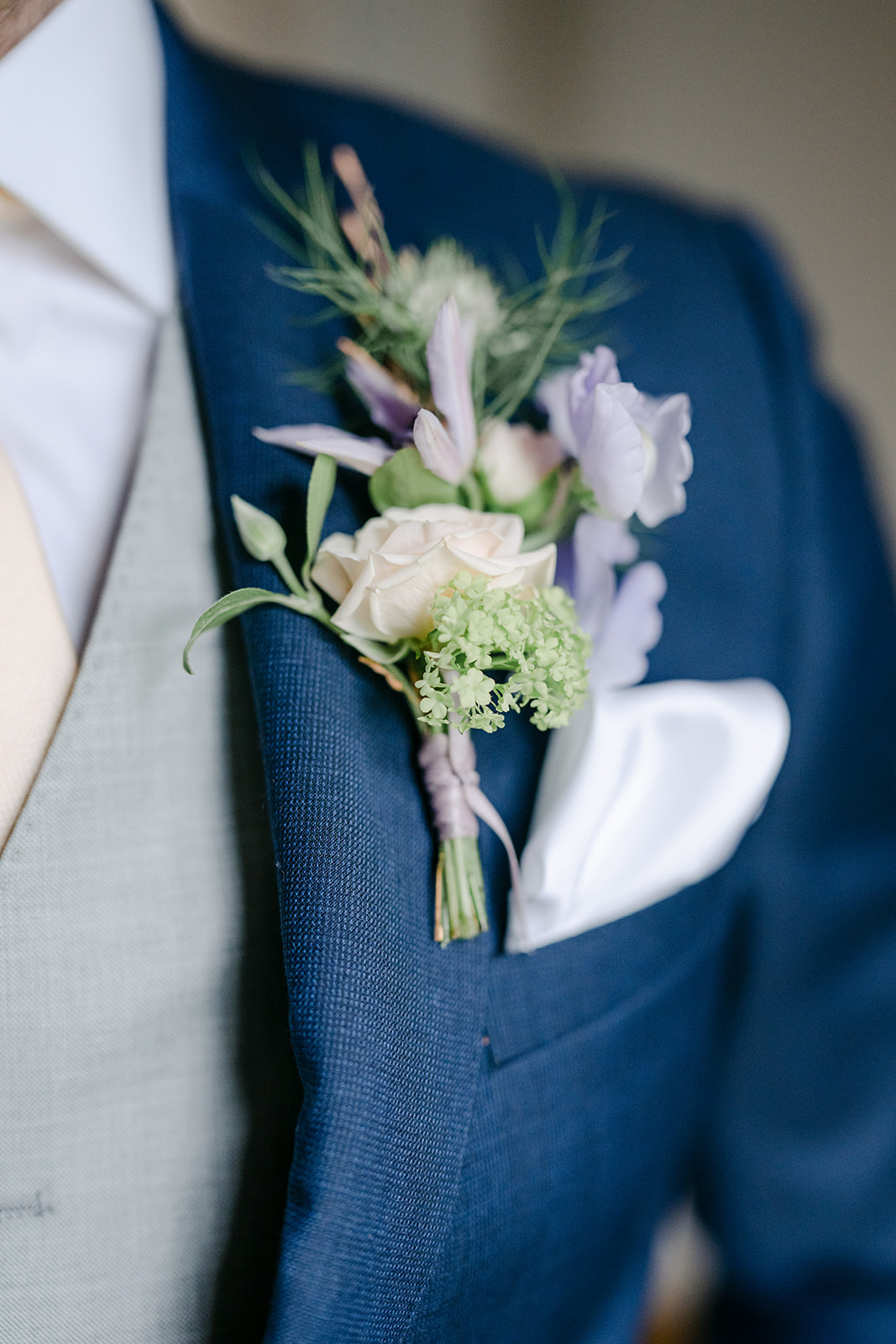 white and french blue boutonniere