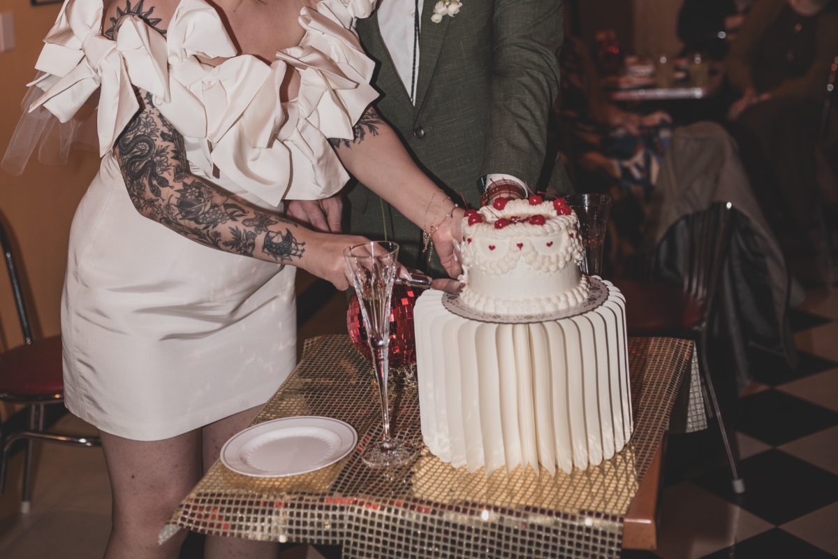 bride and groom cut cake at vegas style elopement