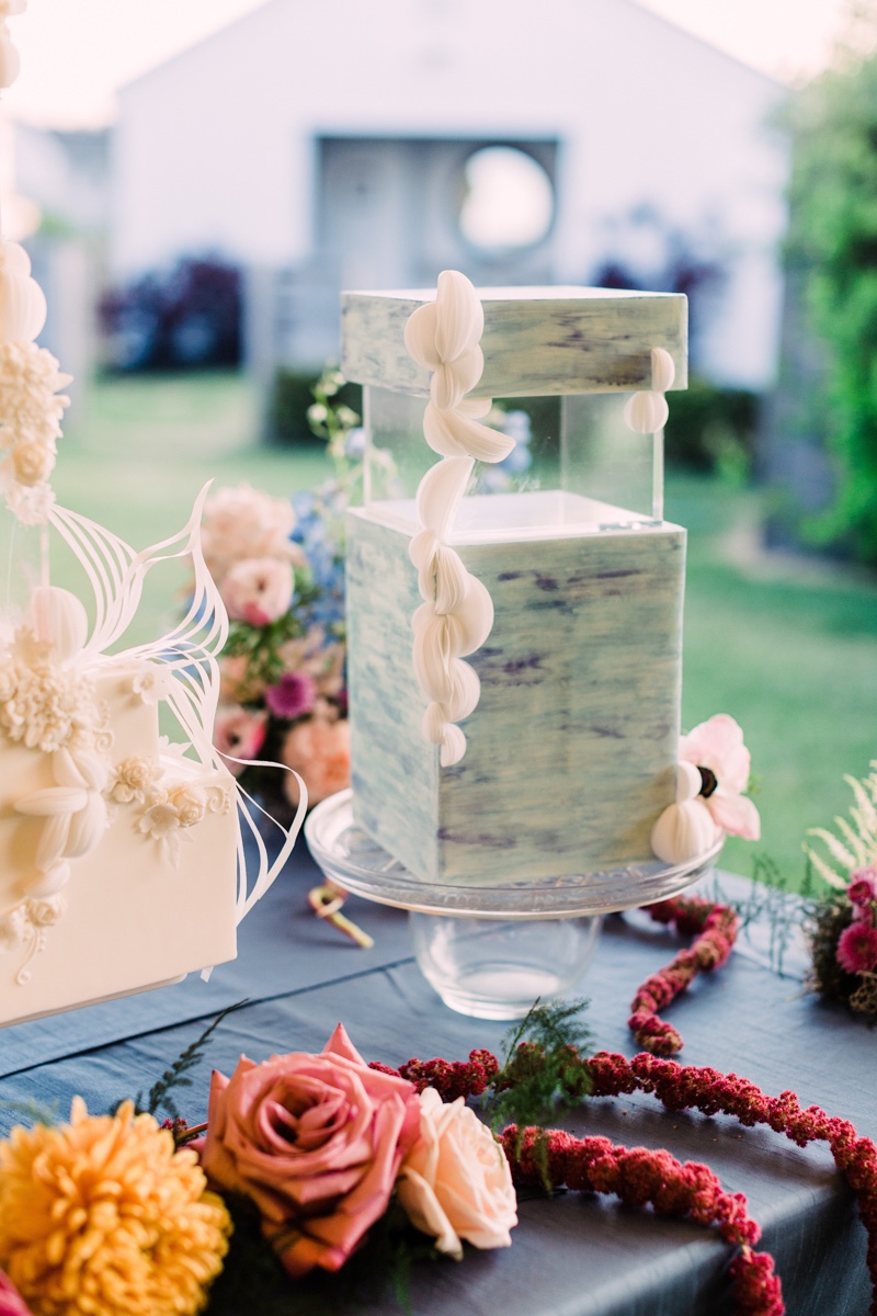 modern blue wedding cake with acrylic tiers