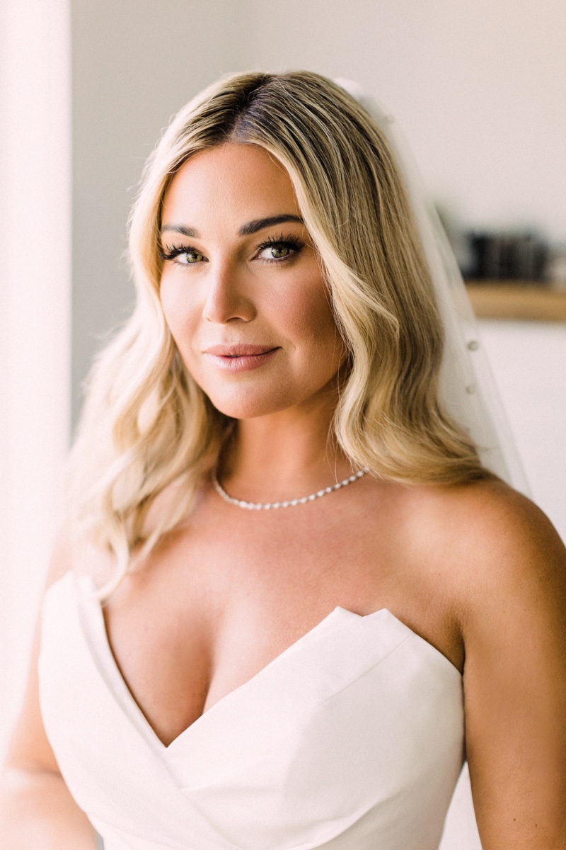 bride with loose waves and a diamond necklace