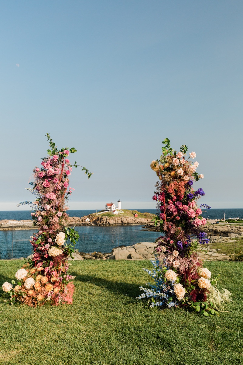 colorful asymmetrical floral arch for wedding