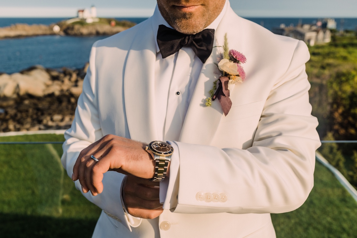 groom putting on watch