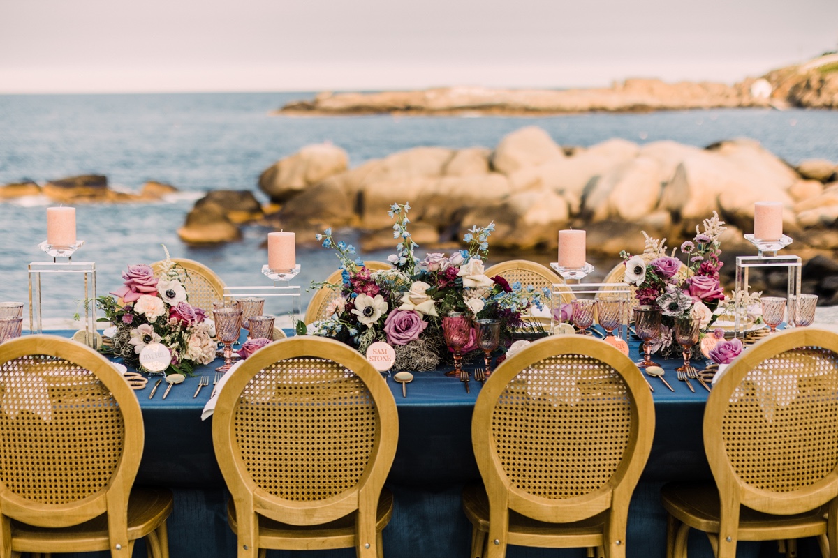 coastal outdoor wedding reception with wood cane chairs