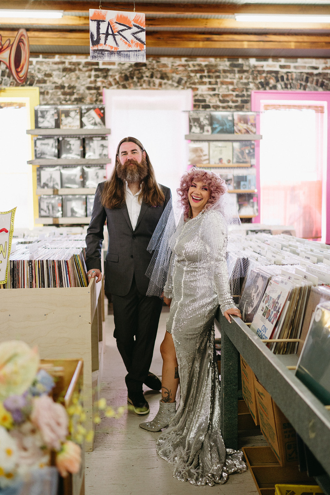 bride and groom record store portrait session