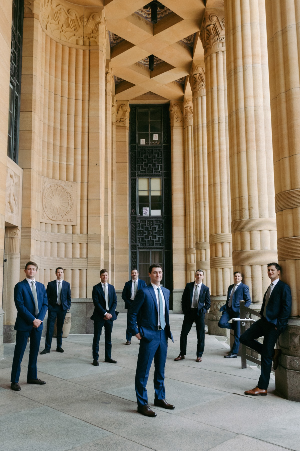 groom and groomsmen in blue suits