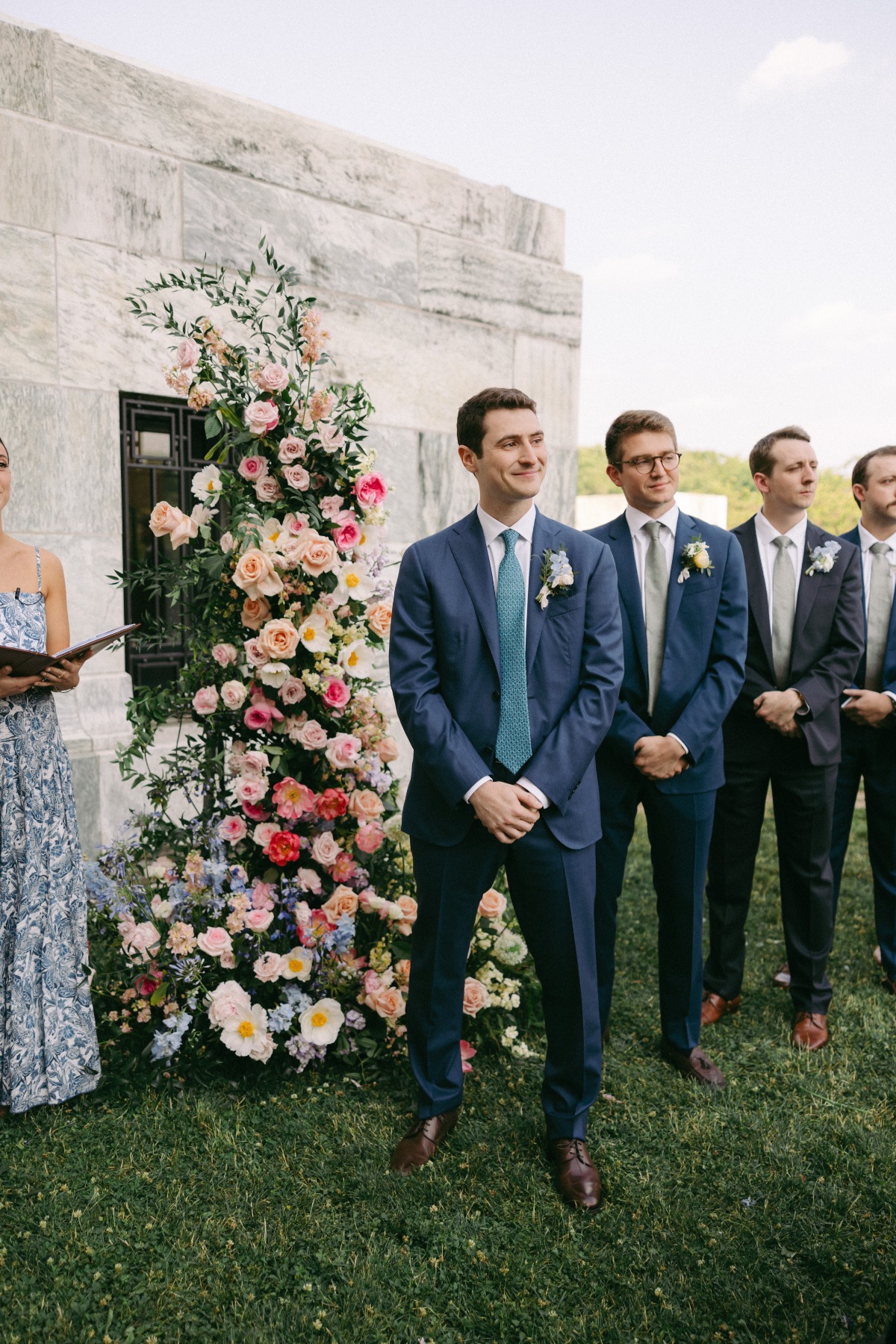 groom waiting for bride at outdoor ceremony