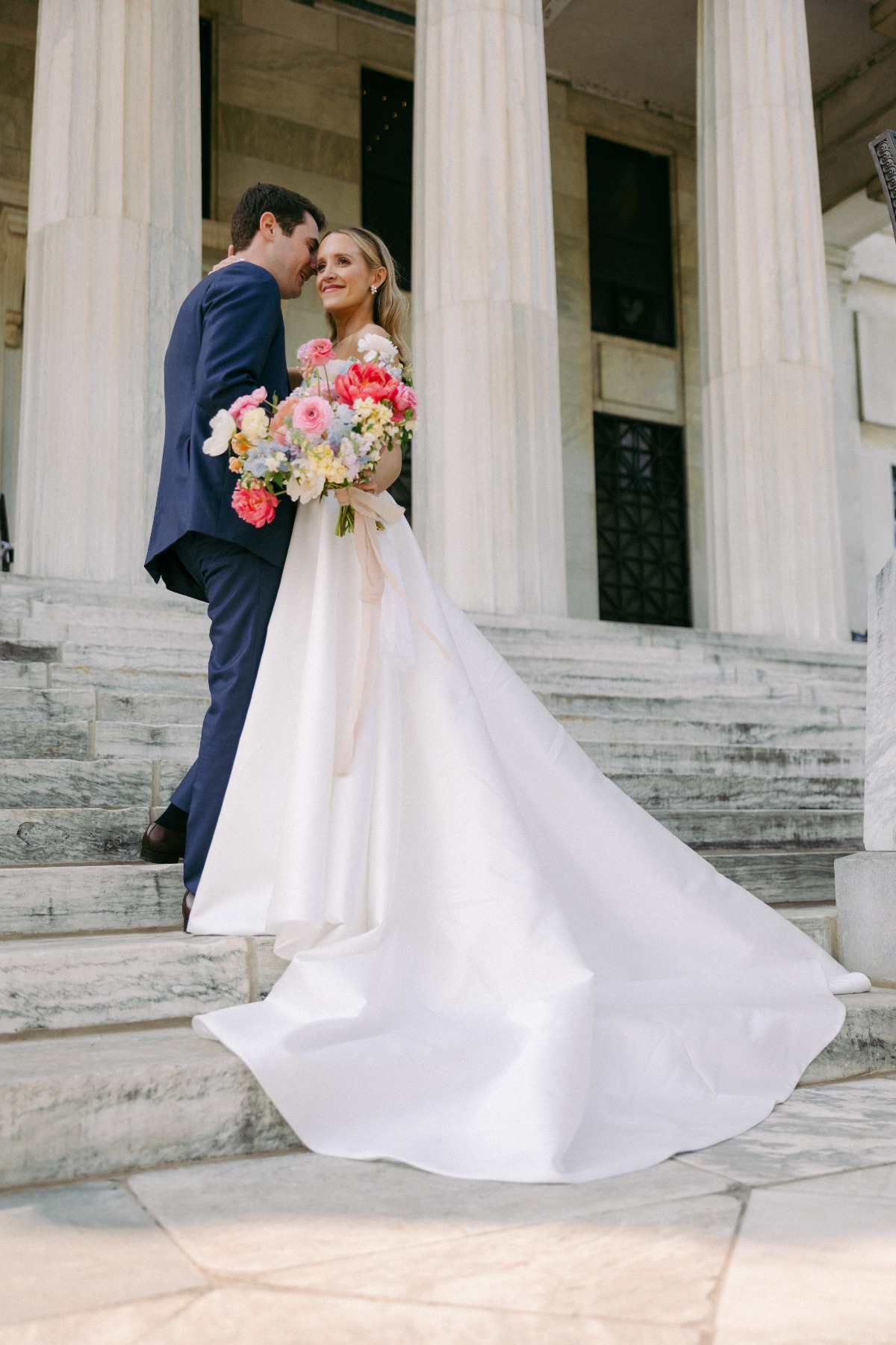 bride and groom on museum steps