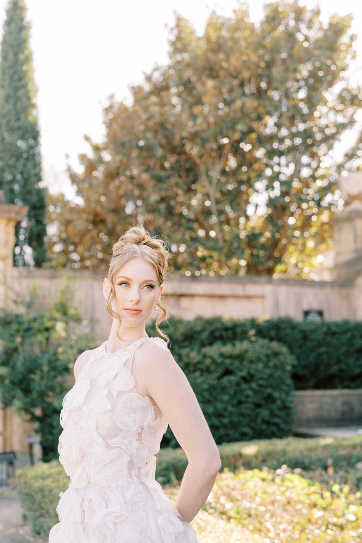 Elegant bride in avant garde designer wedding dress