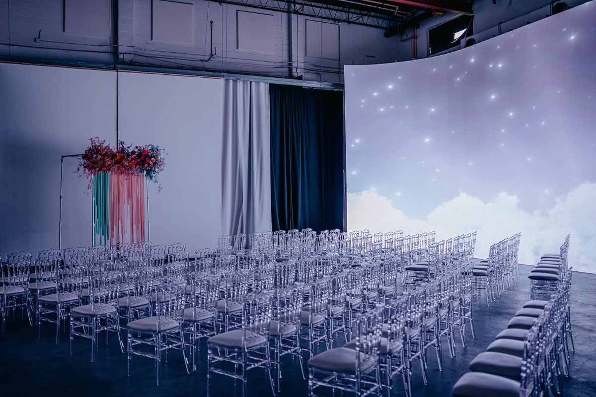 screen projection wedding backdrop with acrylic chairs