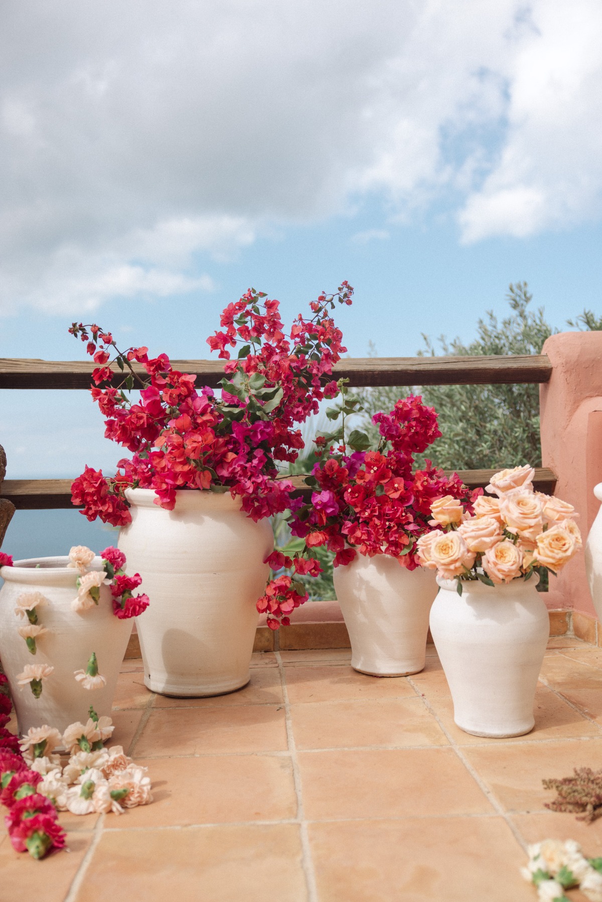 flower arrangements in large white vases