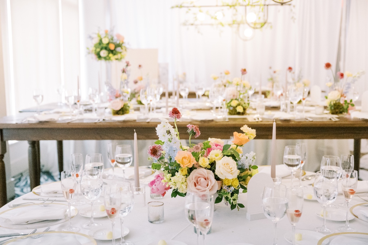 colorful centerpieces on white linens